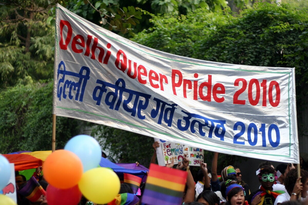 Delhi Queer Pride 2010 banner held above parade participants